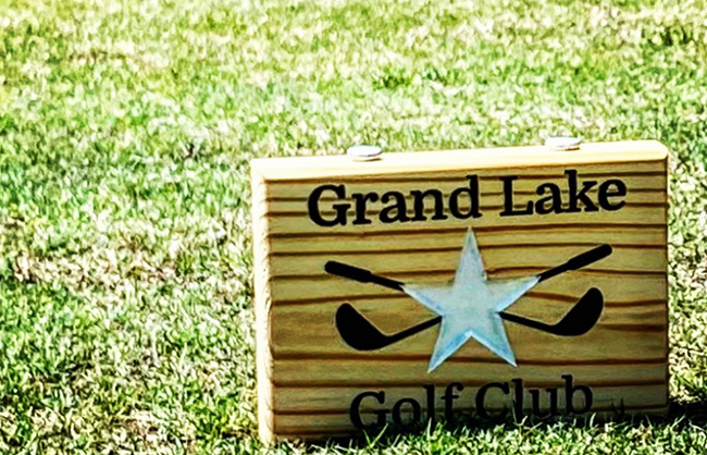 sign of grand lakes golf club on course